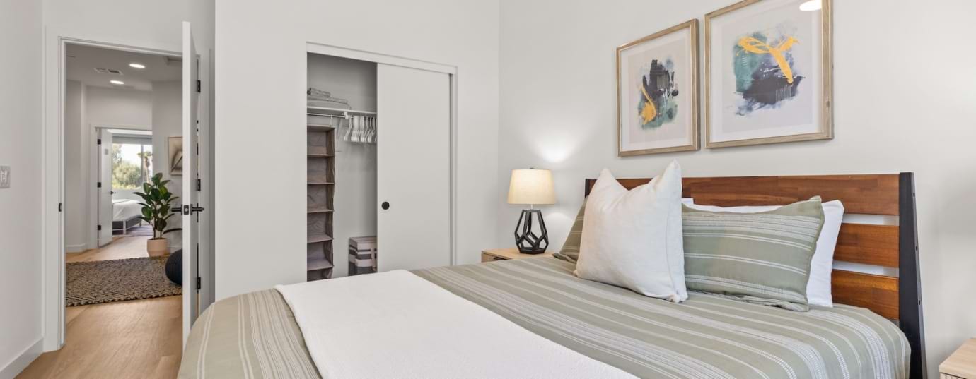 Furnished bedroom shown — representative home at Canopy at the Trails.