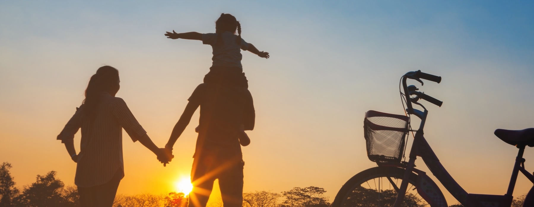 a family walking at sunset